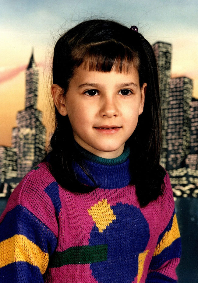 Carla Farina as a kid wearing dope 80's sweater